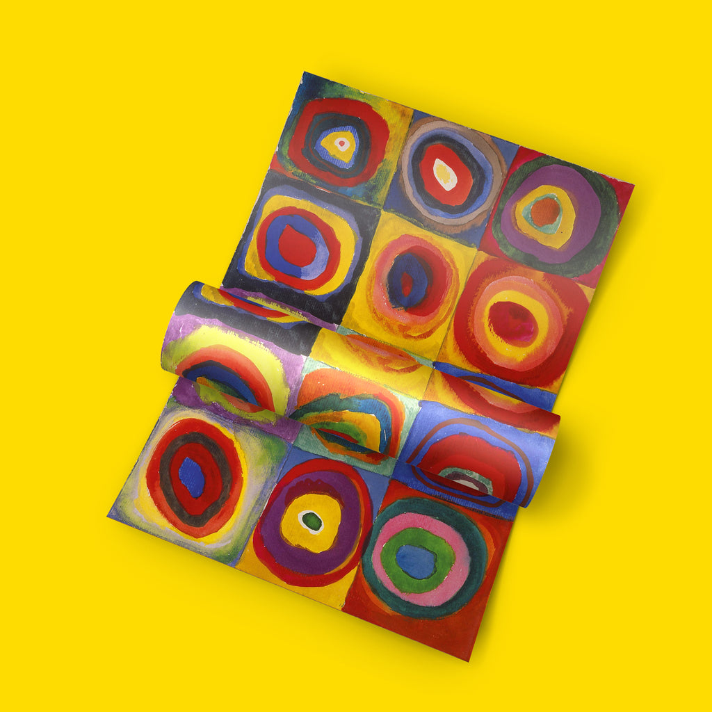 A colourful abstract patterned print displayed on a solid bright yellow background. The pattern features concentric circles and squares in red, yellow, blue, purple, green, and orange.