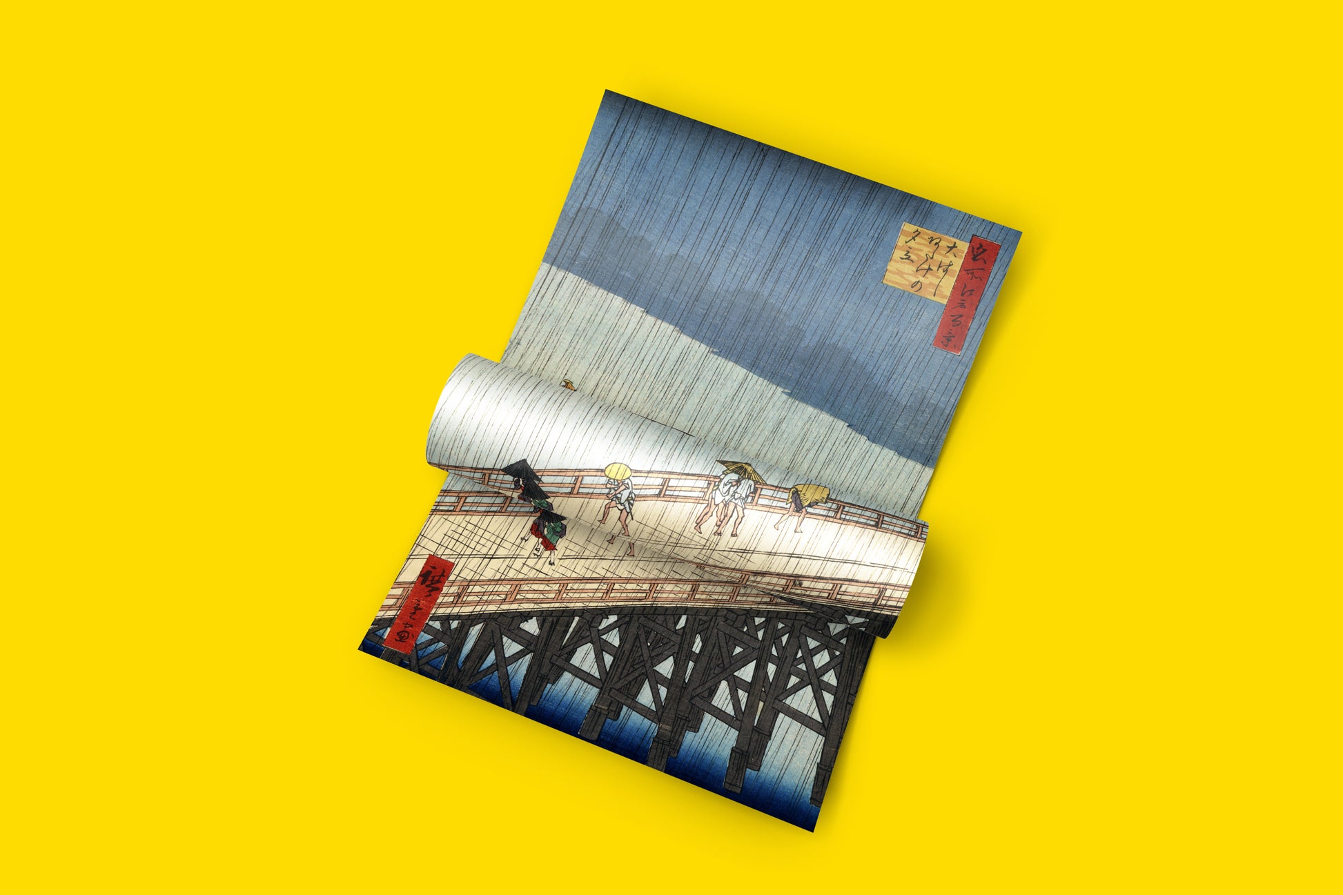 A striking piece of wall art featuring the Edo period masterpiece Sudden Shower over Shin-Ohashi Bridge and Atake, perfect for home decor.