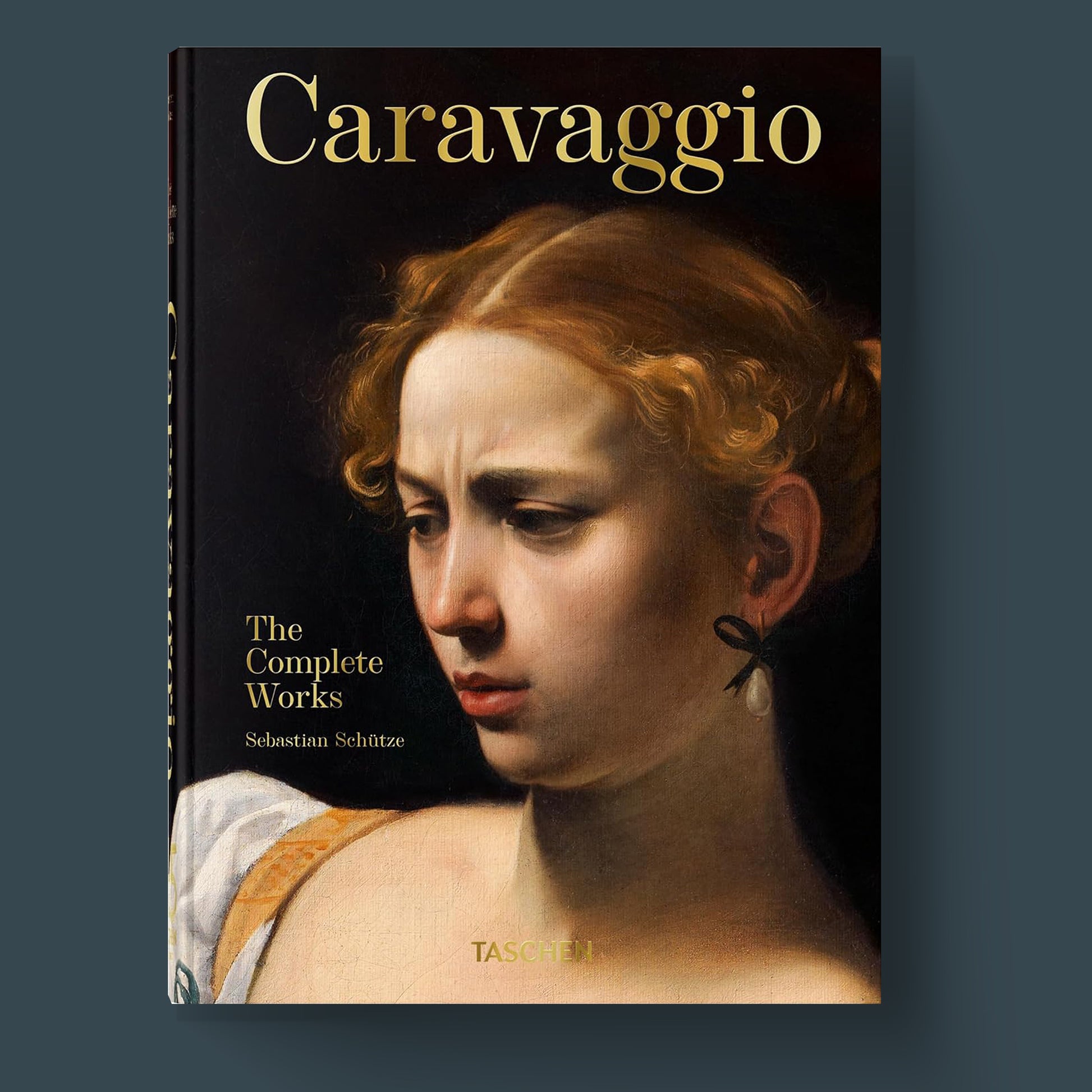 TASCHEN Caravaggio The Complete Works luxury art book cover with a detail of the painting 'Judith Beheading Holofernes' on the front, ideal for a fine art coffee table book collection.