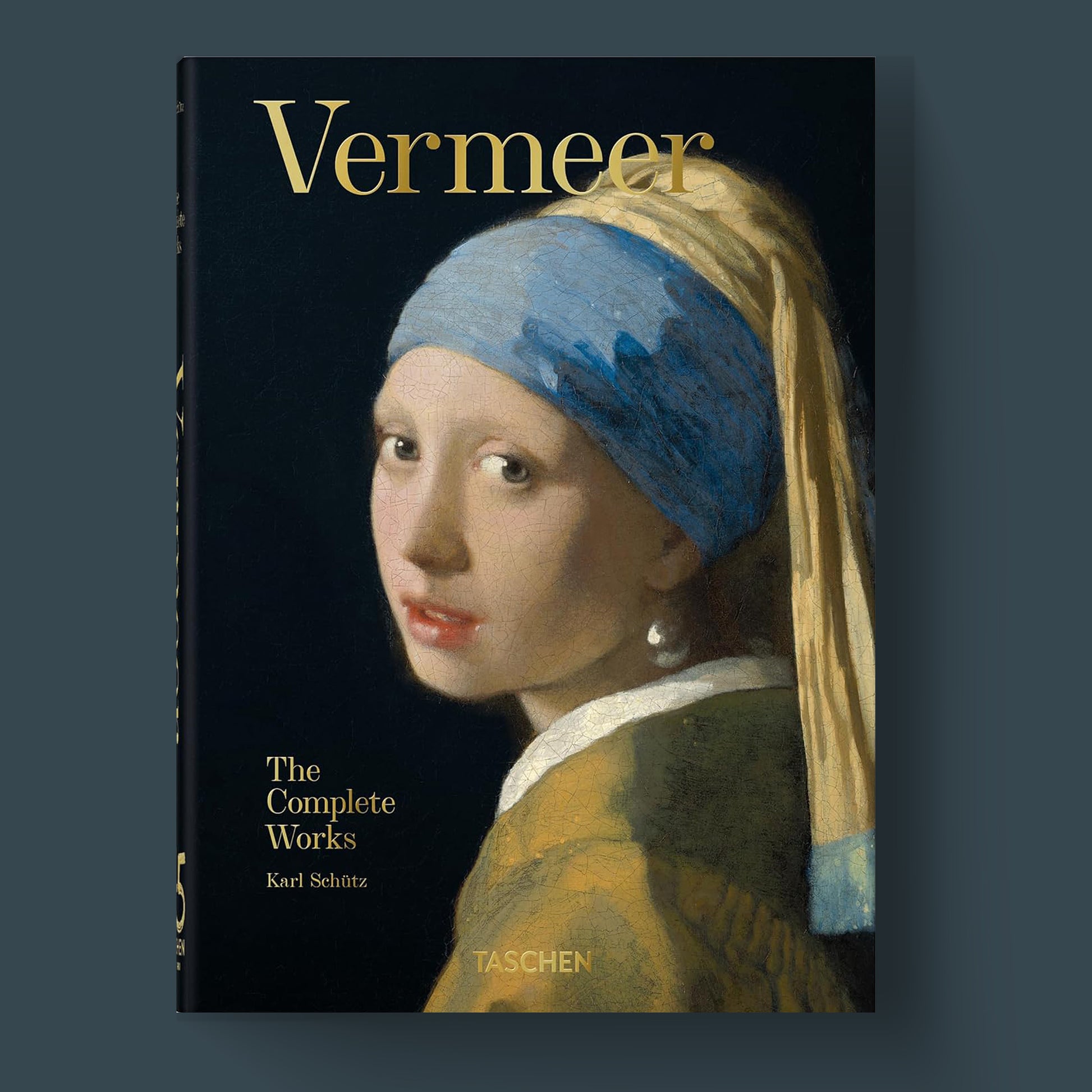 A luxury hardcover TASCHEN art book cover for 'Vermeer. The Complete Works,' featuring a high-quality detail of the masterpiece 'Girl with a Pearl Earring.'
