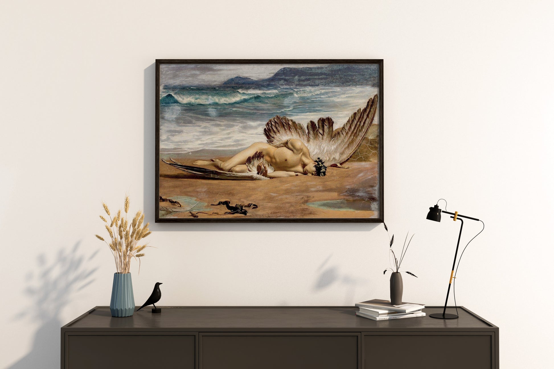 Framed artwork of The Death of Icarus above a wooden console table.