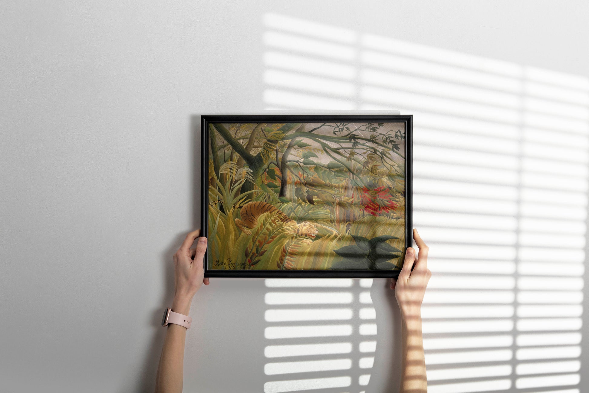 Close-up of a high-quality framed giclée print of Rousseau's "Tiger in a Tropical Storm," showcasing the paper and frame detail as stylish wall art for a bedroom.