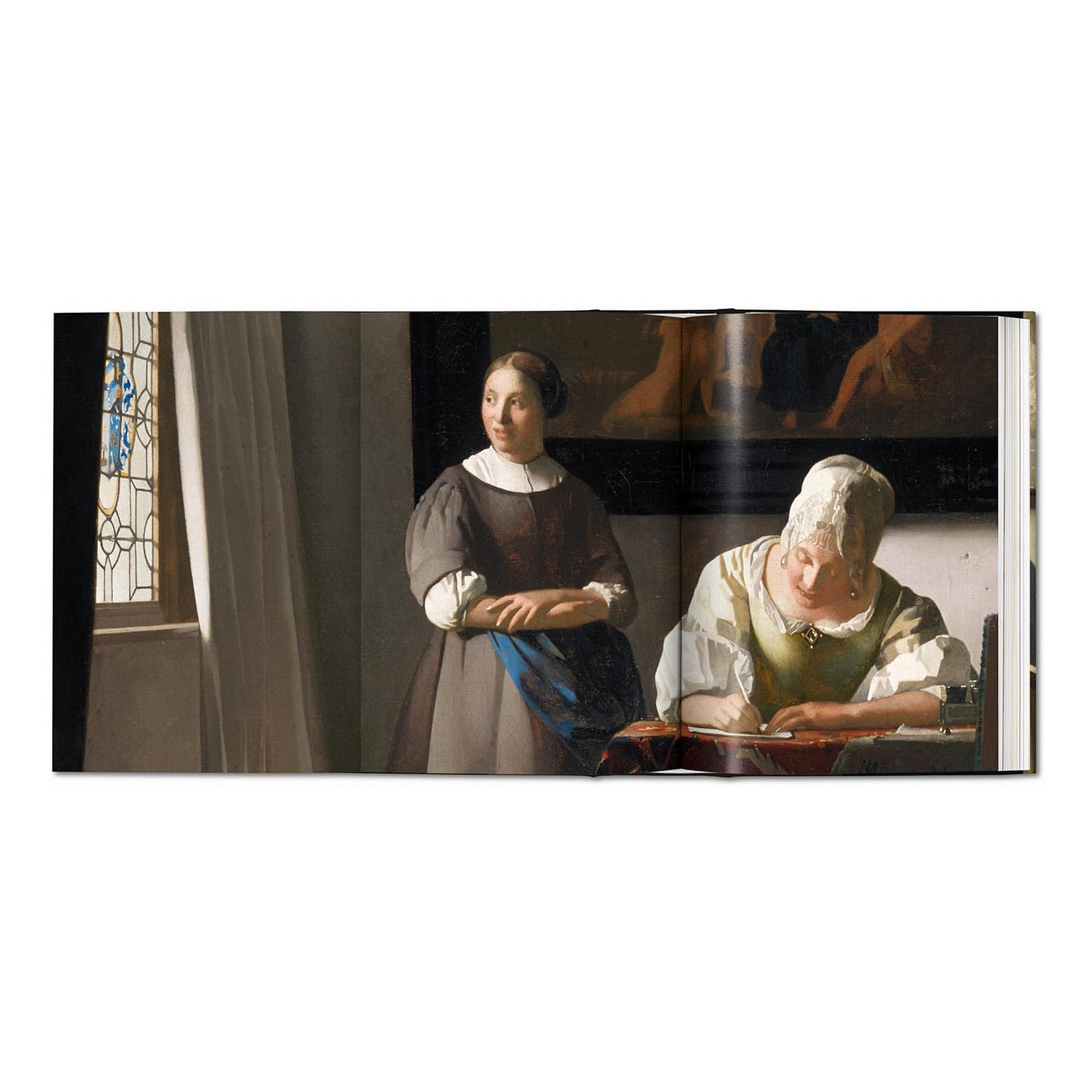 A photograph of the open book showing the painting 'Lady Writing a Letter with her Maid' alongside contextual essays on Vermeer's complete works.