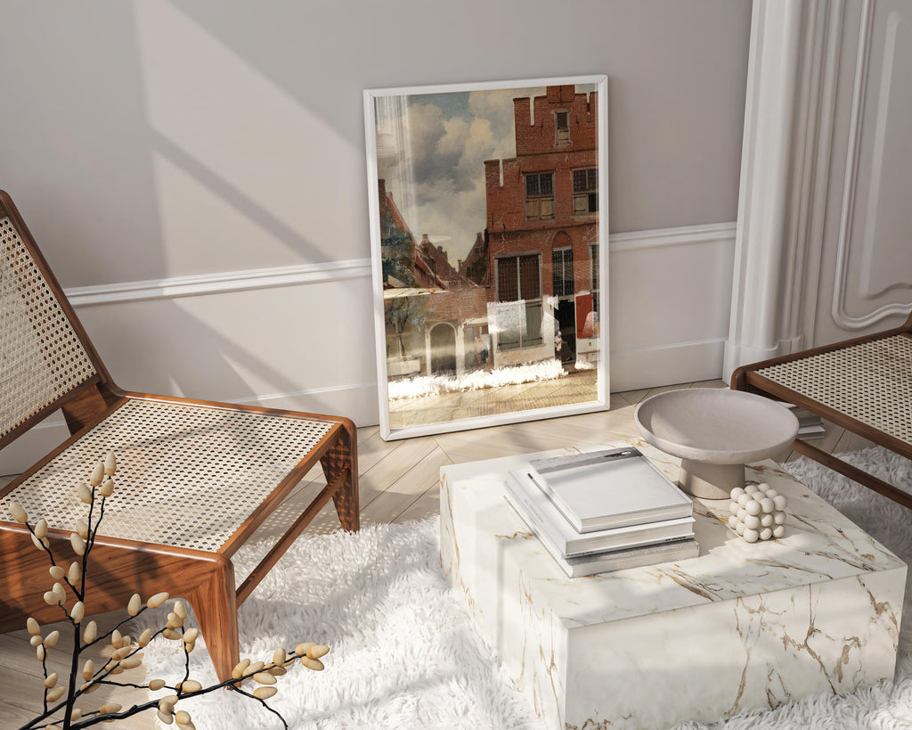 Johannes Vermeer's 'The Little Street' fine art print elegantly framed and displayed in a luxurious, modern living room setting.