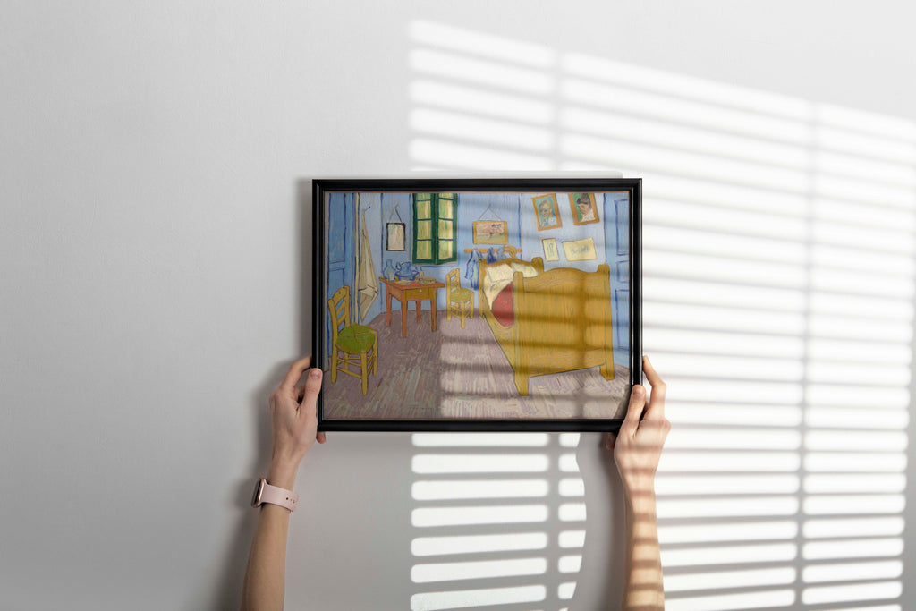 Elegant framed reproduction of van Gogh's famous bedroom painting hung as sophisticated wall art, perfect example of classic fine art home decor display