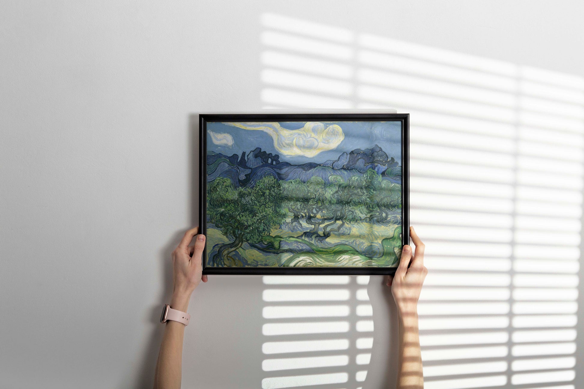 Vincent van Gogh Olive Trees 1889 framed art print hanging on wall, premium giclée fine art reproduction in decorative frame perfect for interior design and gallery wall