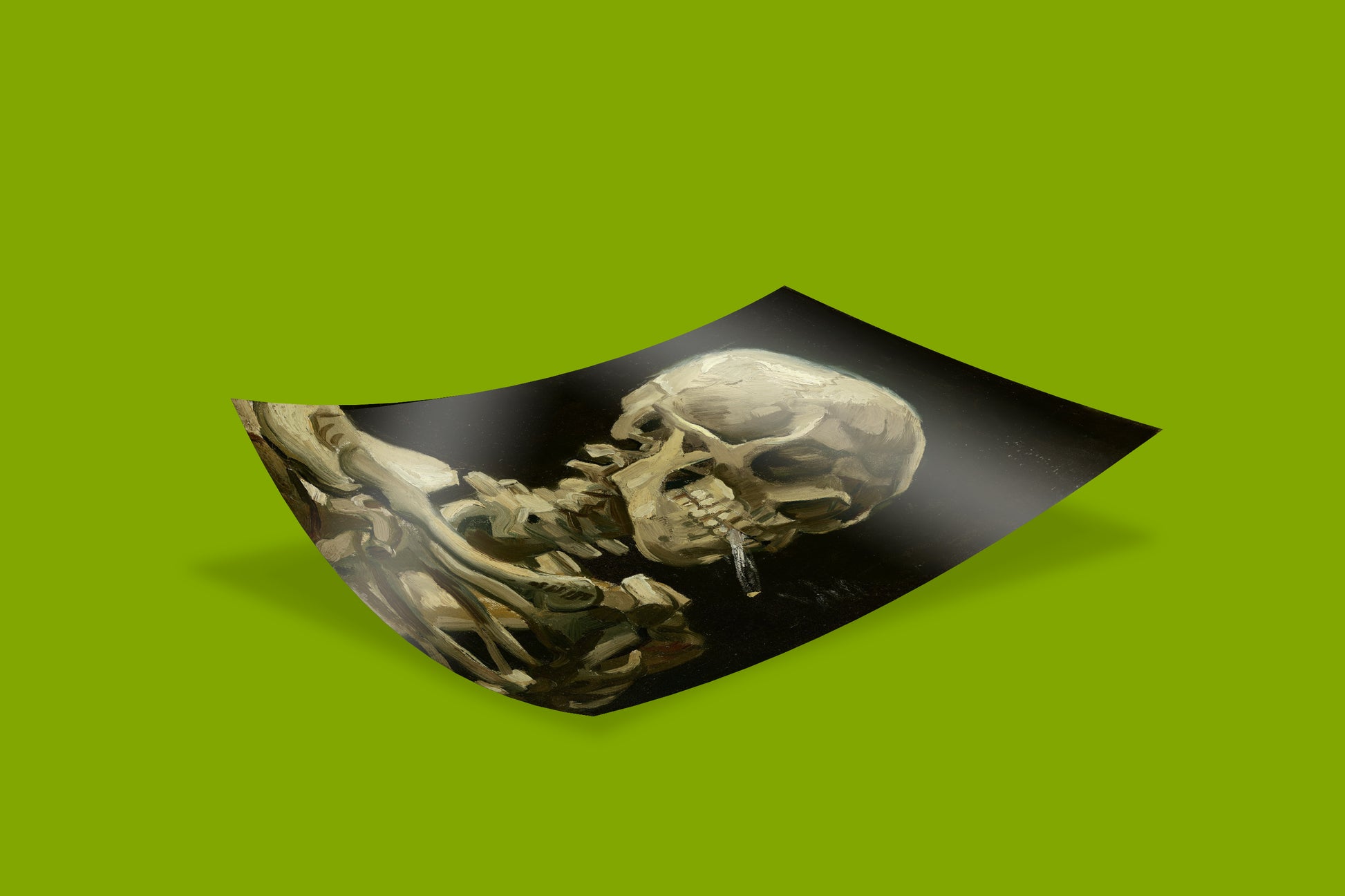 Unframed art print of Vincent van Gogh's 'Head of a Skeleton with a Burning Cigarette' displayed on a green background. This individual print sheet is ready for framing and is a distinctive piece of fine art wall decor.