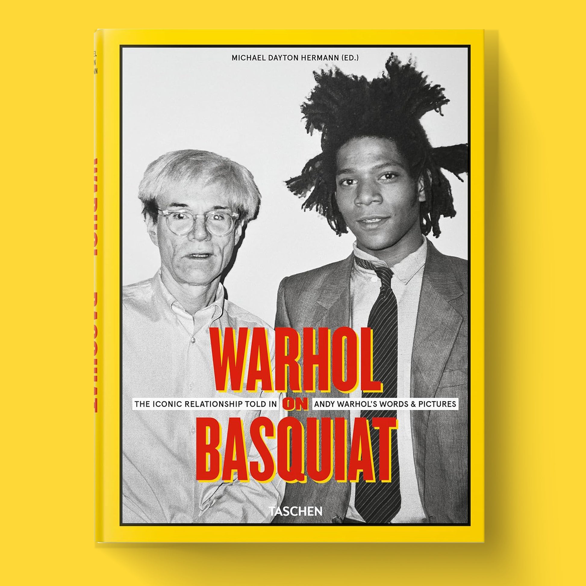 The cover of the luxury hardcover art book "Warhol on Basquiat" by TASCHEN, featuring a black and white photograph of Andy Warhol and Jean-Michel Basquiat.