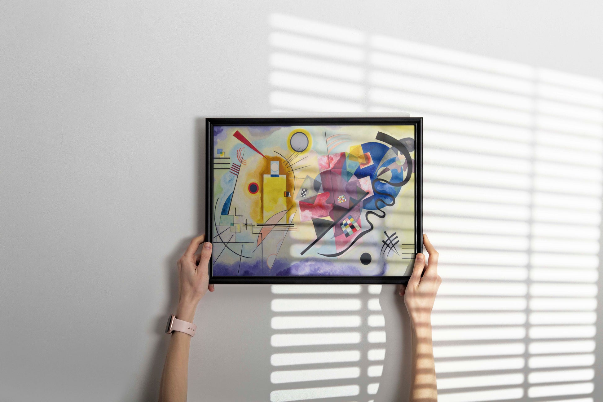 Wassily Kandinsky Yellow-Red-Blue framed wall art hanging in contemporary home interior - museum-quality abstract geometric print with stylish frame, perfect modern decor accent