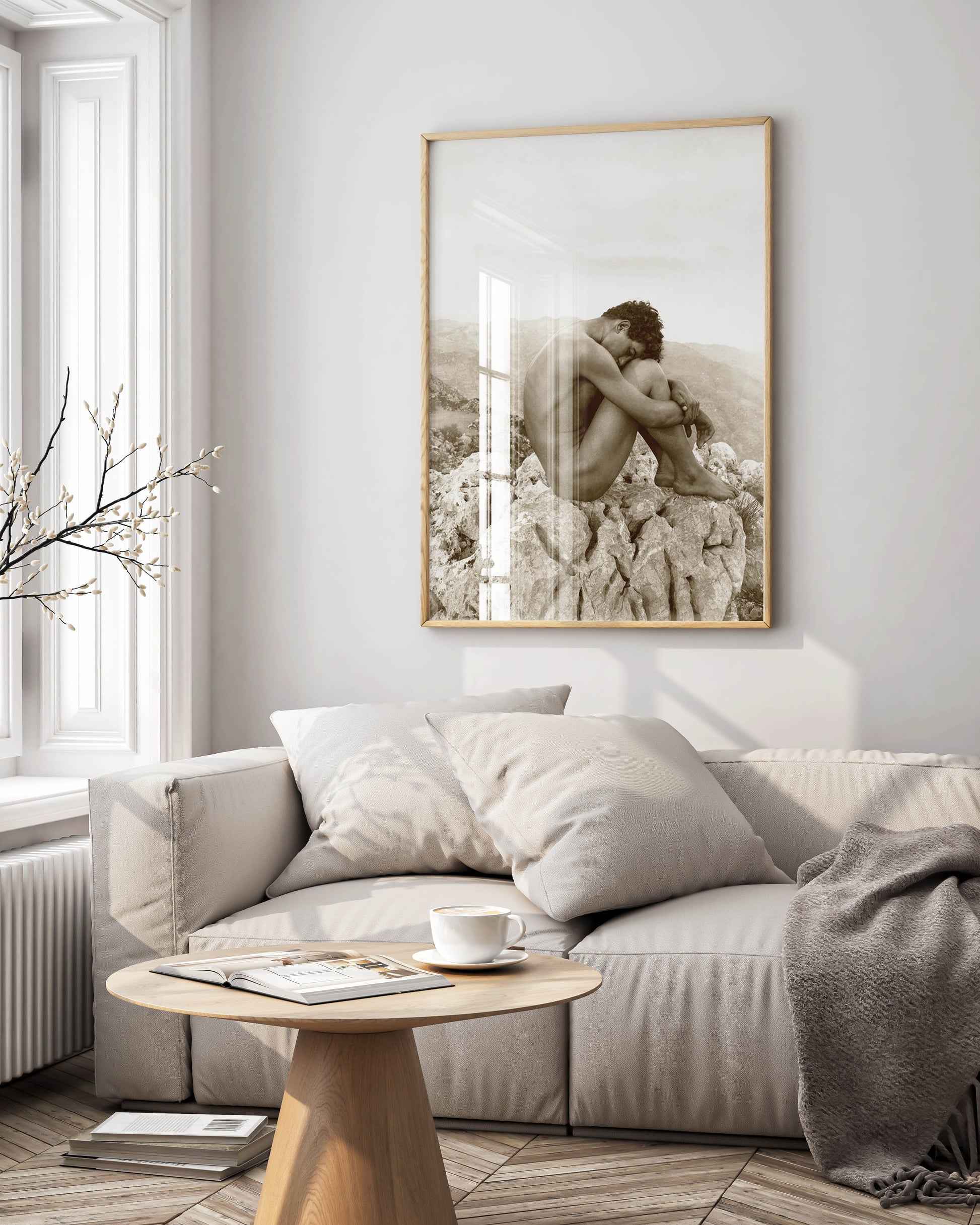 A framed Wilhelm von Gloeden "Cain" photography print, a fine art piece, displayed as elegant wall art in a modern, luxurious interior with stylish furniture.