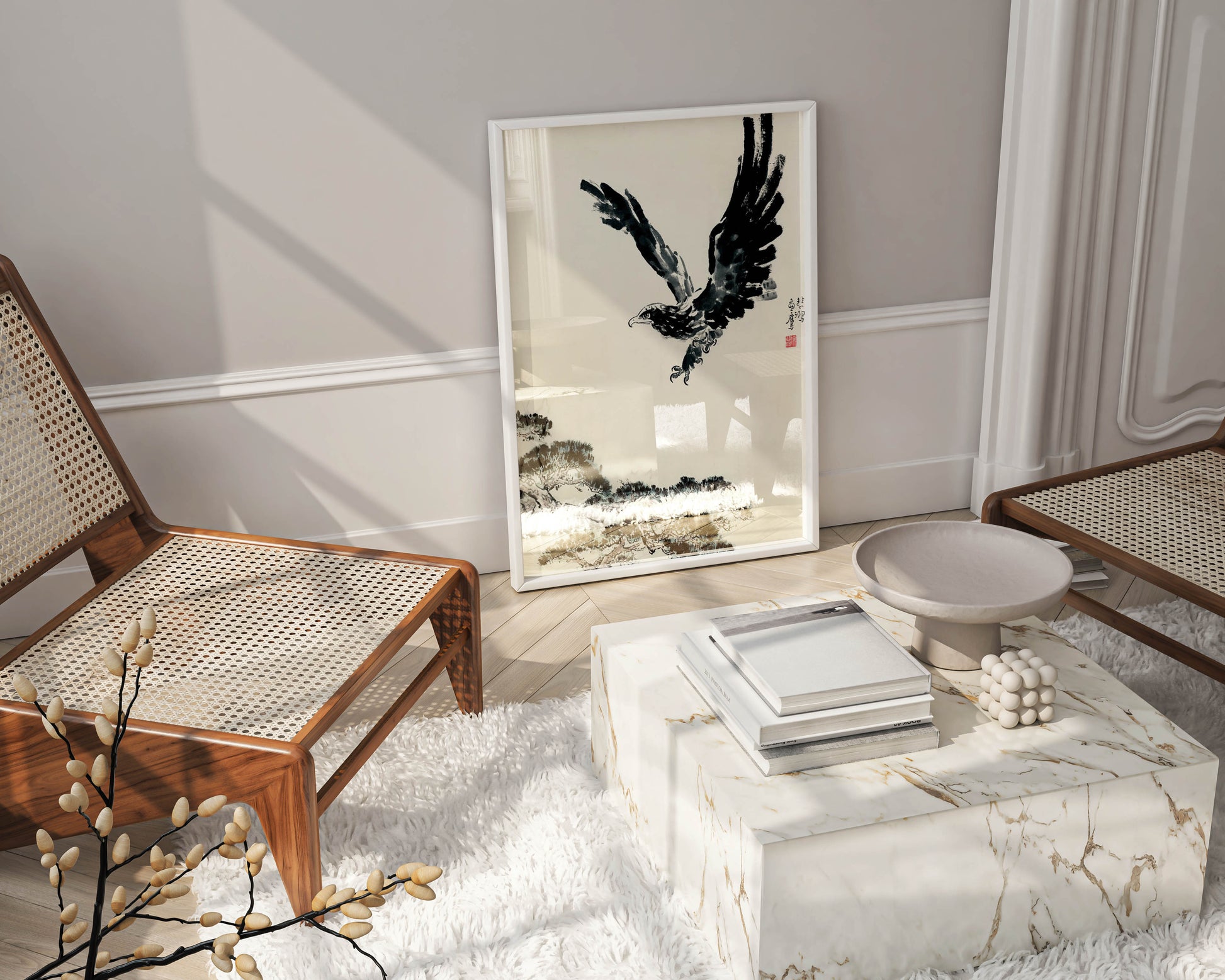 A framed Xu Beihong "The Pine and the Eagle" fine art print leaning on a wall in a modern living room setting.